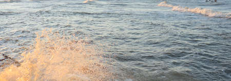 Sea water surface texture. Waves and sphales, storm. Soft sunlight. Panoramic image, graphic...
