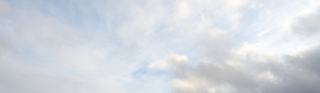 Ornamental clouds. Dramatic sky after the storm. Cloudscape. Soft sunlight. Panoramic image,...