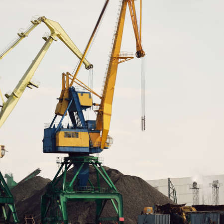 Modern coal terminal in Riga, Latvia. Cranes close-up. Baltic sea. Freight transportation,...