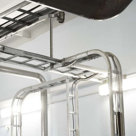 Industrial water treatment and boiler room. Shiny steel metal pipes, piping, connections. Industry,...