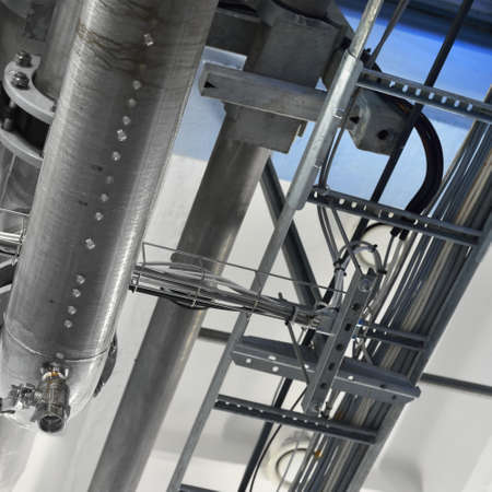 Industrial water treatment and boiler room. Shiny steel metal pipes, piping, connections. Industry,...