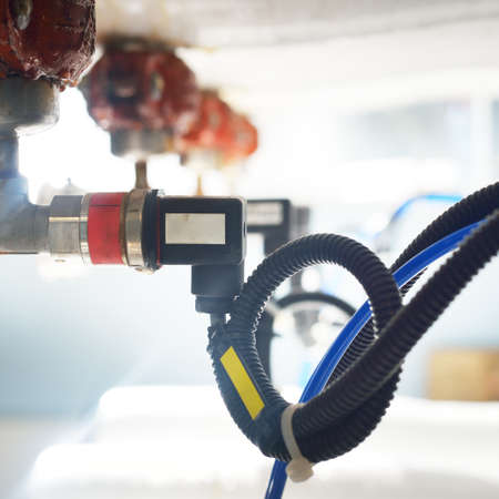 Industrial water treatment and boiler room. Pipes, piping, levers, barometers, connections....