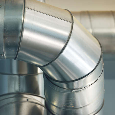 Industrial water treatment and boiler room. Shiny steel metal pipes, piping, connections. Industry, technology, biotechnology, chemistry, heating, work safety, special equipment. Panoramic viewの写真素材