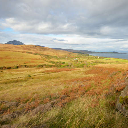 Mountain peaks, valleys and hills of Jura island. Panoramic view. Dramatic sky. Scotland, UK. Atmospheric landscape. Travel destinations, landmarks, hiking, ecotourism, environmental conservationの写真素材