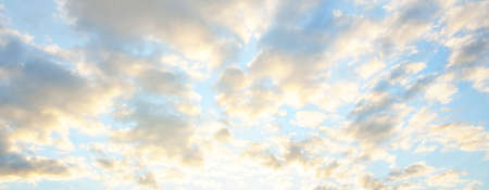 Clear blue sky with glowing clouds. Soft sunlight. Dramatic cloudscape. Concept art, meteorology,...