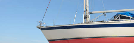 45 ft cruising sailboat standing on land in a yacht marina. Transportation, nautical vessel, repair...