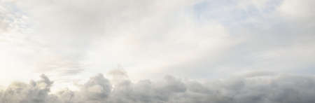 Clear blue sky with glowing clouds. Soft sunlight. Dramatic cloudscape. Concept art, meteorology, heaven, peace, graphic resources, picturesque panoramic sceneryの写真素材