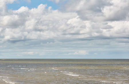 Panoramic view of the Baltic sea from a sandy shore on a sunny summer day. Clouds. Kabli beach, Estonia. Nature, eco tourism, wanderlust, vacation conceptsの写真素材