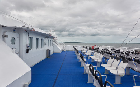 Modern ferry ship, empty deck, passenger seats. Muhu strait, Estonia.の写真素材