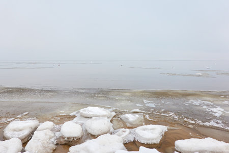 Sea in a thick fog. Atmospheric monochrome landscape. Nature, environmental conservation, ecology, winter, climate change, global warmingの写真素材