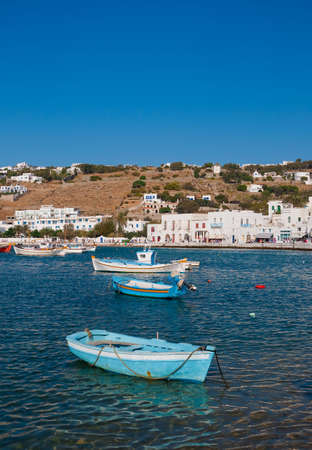 The buildings of the Greek island of Mykonos in the port bay with boats in the seaの写真素材