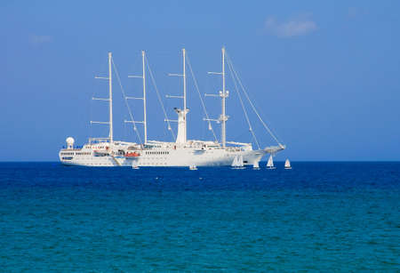 Cruise ship and sailing small boats in the competition. Greece.の写真素材
