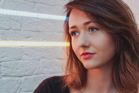 Beautiful Young Girl Portrait with Contact Lens and neon lightsの写真素材