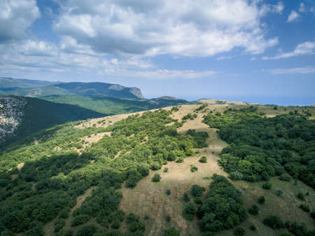 Aerial view mountains and sea in summer, vacation mood, landscapeの写真素材