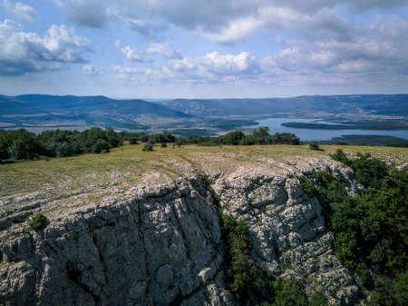 Aerial view mountains and sea in summer, vacation mood, landscapeの写真素材