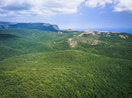 Aerial view mountains and sea in summer, vacation mood, landscapeの写真素材