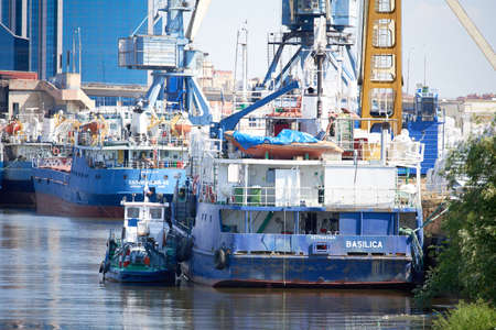 Astrakhan, Russia - 08.12.2020: Cargo ships stand in the port of Astrakhan on the Volga river