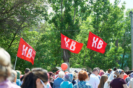 Astrakhan, Russia - 05.01.2016: Red flags with Cyrillic letters meaning Christ is Risen above a...