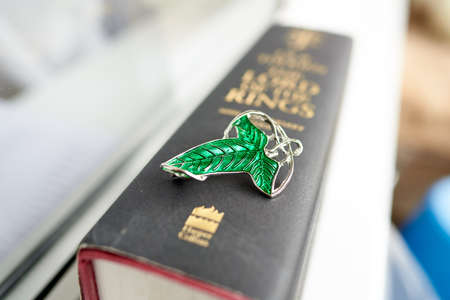 Astrakhan, Russia - 03.26.2021: Green brooch on Lord of the Rings bookのeditorial素材