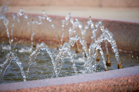 Water splashing in the fountain. Freeze motion effect achieved by fast shutter speed camera
