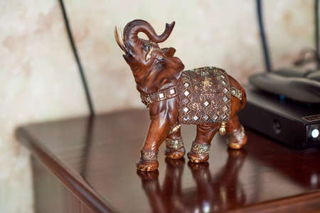 Souvenir polystone An elephant in a blanket-chain mail with mosaics and gold patternsの写真素材