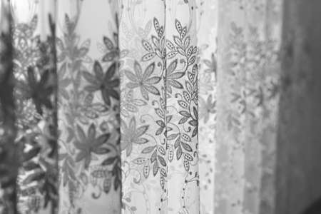 Floral embroidered curtain. Black and white image