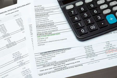 Close-up Calculator On Financial Report - Business Accounting Conceptの写真素材