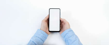 Male hands holding smartphone with blank screen on white backgroundの写真素材