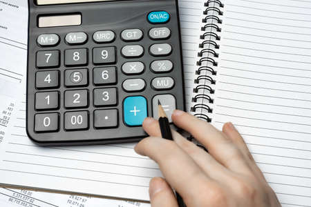 Notebook, Pencil And Calculator On Financial Report - Business Accounting Conceptの写真素材
