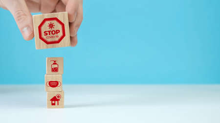 Manual organization wood block stacking with health icon coronavirus. Insurance for your health conceptの写真素材