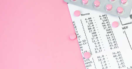 Health insurance concept. Pills near financial documents on pink background. Top view. Medical...