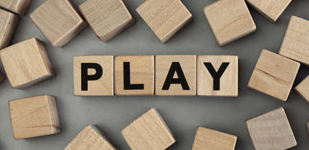 Word PLAY made with wood building blocks. Top view, conceptの写真素材