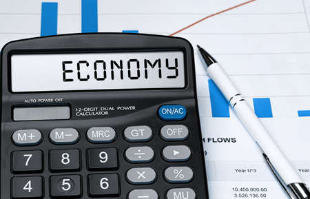 Word ECONOMY on calculator. Business and tax concept. Stock photoの写真素材