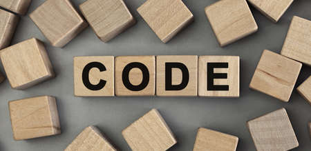 Word CODE made with wood building blocks. Top view, conceptの写真素材