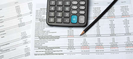 Pencil And Calculator On Financial Report - Business Accounting Concept, top viewの写真素材