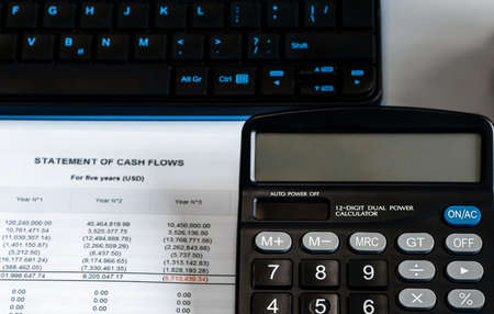 calculator on financial papers at the table close up. Top view, conceptの写真素材