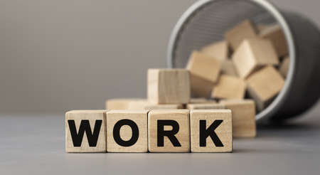 Word WORK made with cube wooden block on a desk, conceptの写真素材
