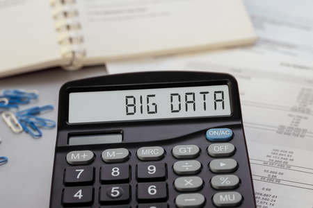 Calculator with the text big data on display. Business, tax and financial conceptの写真素材