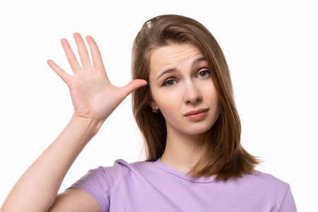 Are you out of your mind. Portrait of puzzled girl gesturing are you crazy, out of your mind. Body...