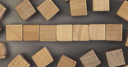 Seven blank wooden cube blocks on the table. Top viewの写真素材