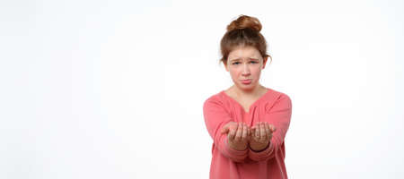 compassionate teen girl isolated on white background asks for help, gestures with hands, reaching...