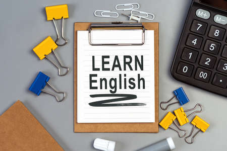 The words Learn English written on a white notebook. Closeup of a personal agendaの写真素材