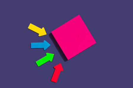 blank pink square sticky note and colorful arrows on purple background, top view. Blank space for...