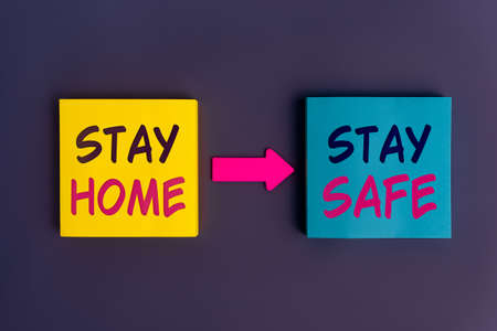 Stay home, Stay safe - concept text on colorful sticky notes. Stay at home and be safe. Self...