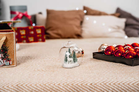 Light bedroom with Christmas decorations, toys and gifts. Winter cozy styleの写真素材