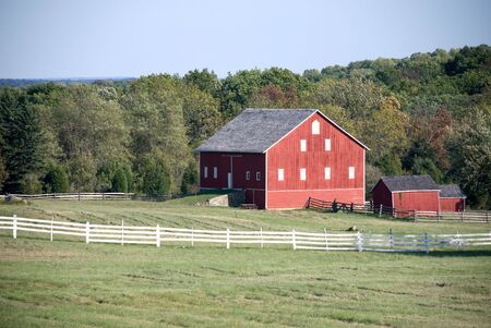 Red barn and fencesの写真素材
