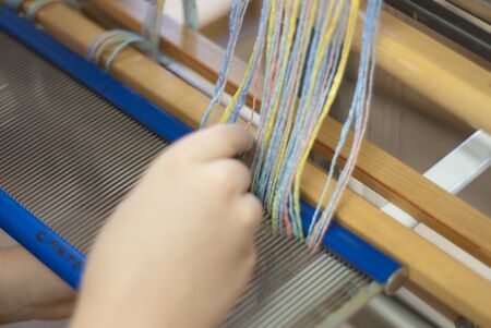 Warping a tabletop loomの写真素材