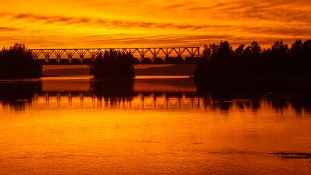 Sunset over the North river and bridgeの写真素材