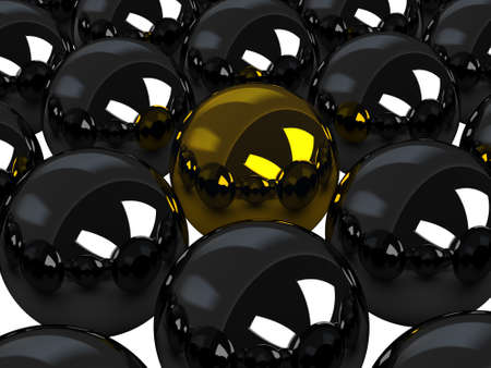 A brilliant golden ball among black ballsの写真素材