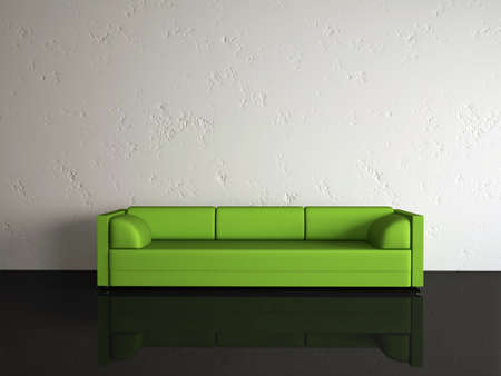 The green sofa near a white wallの写真素材
